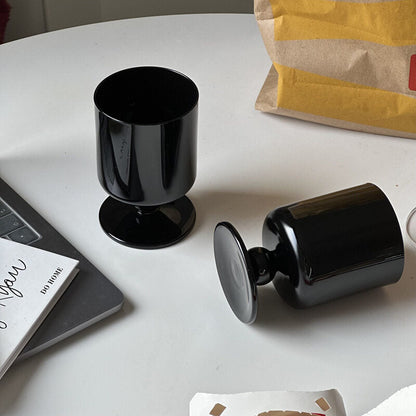 black stemmed glass